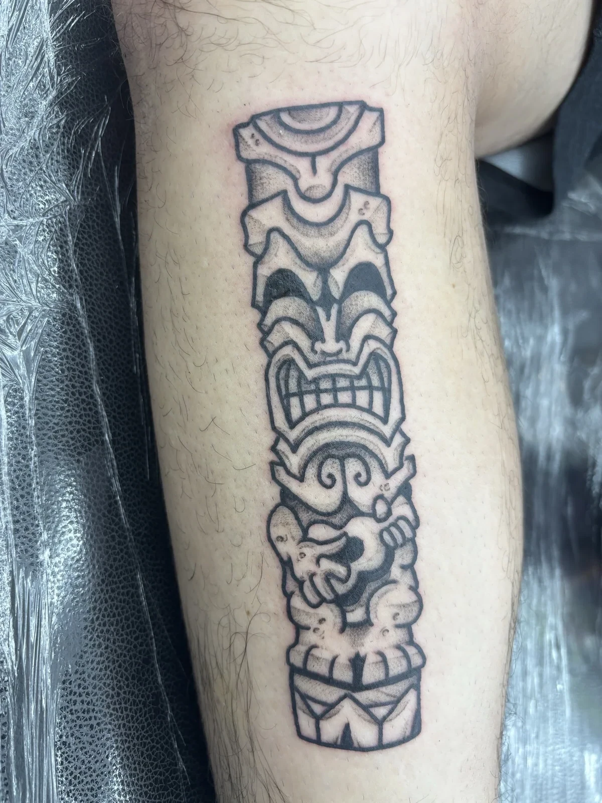Myles Mokuahi blackwork Polynesian tiki tattoo Hawaii